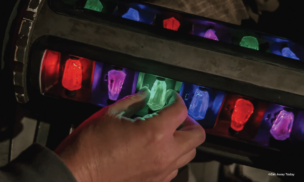 hand selecting a green kyber crystal
