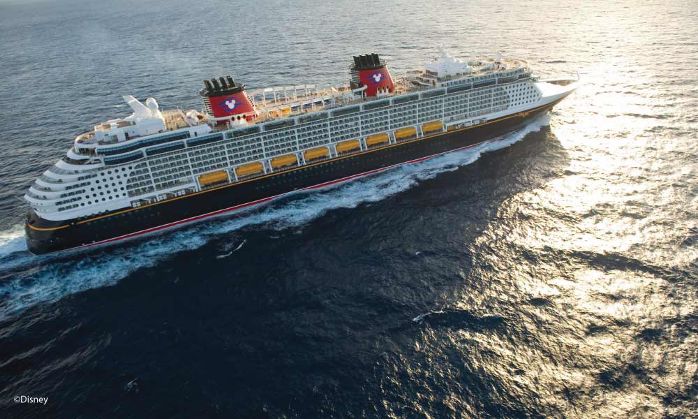 Aerial View of Disney Cruise Ship on the water with sun reflecting on the water