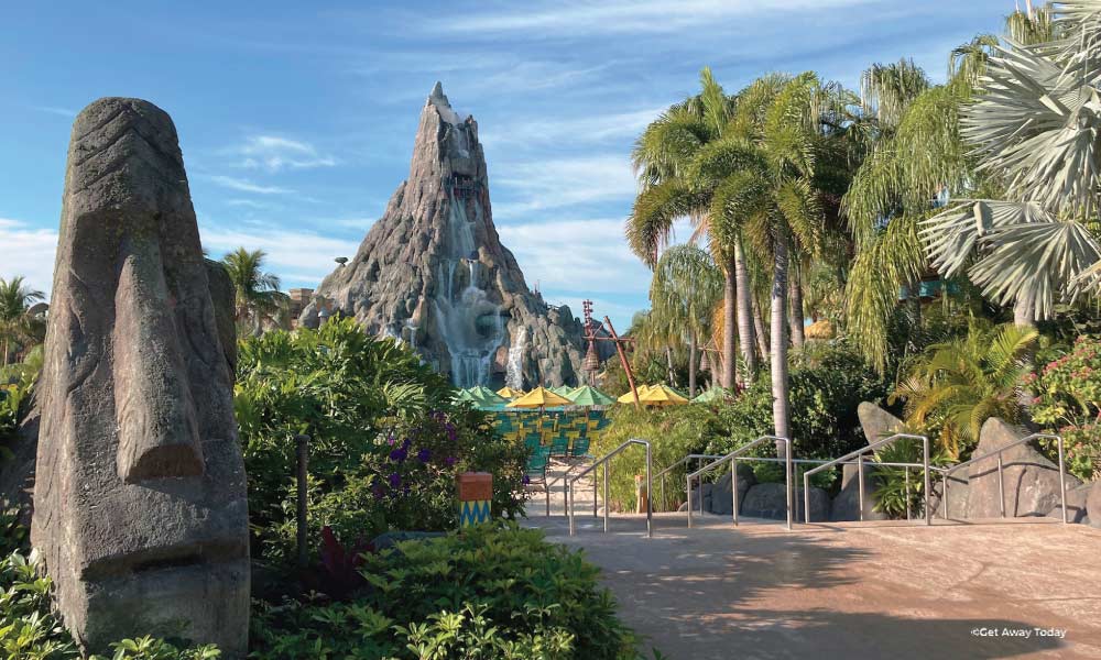 Entrance to Cabana Bay with view of volcano and Moai Figure