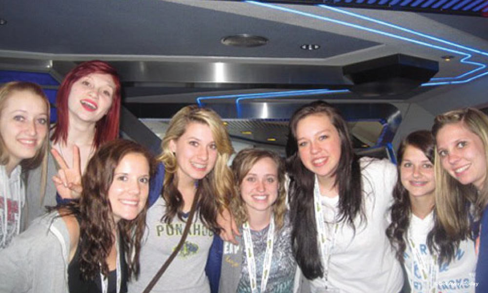 A girl friend group in front of Tomorrowland at Disneyland