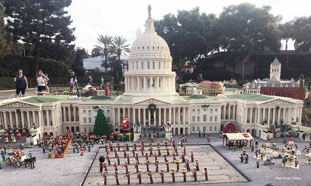 Miniland USA Whitehouse building decorated with Christmas decor and soliders