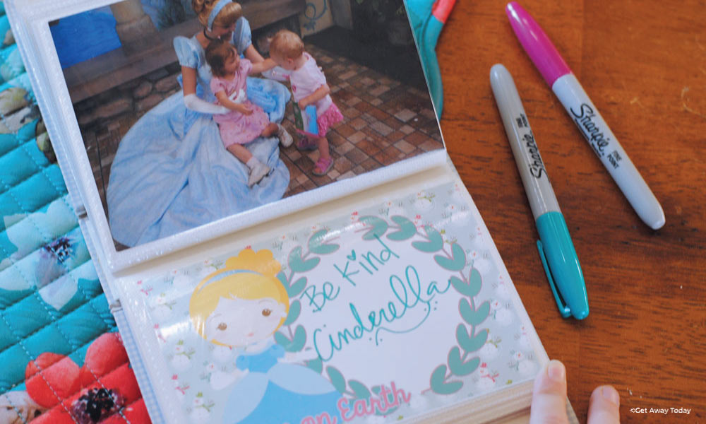 Autograph page in photo book with a picture of Cinderella and two girls above it