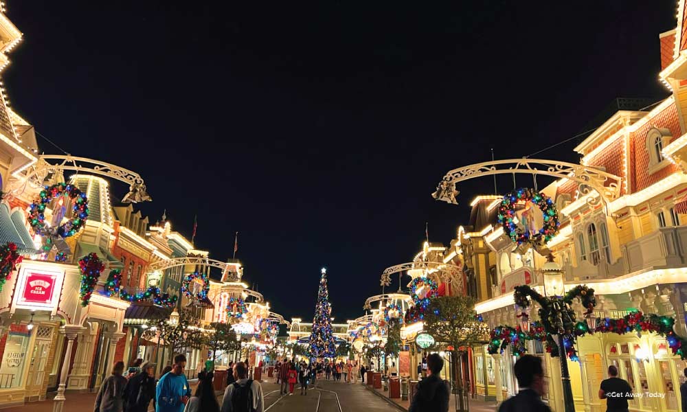 Magic Kingdom Main Street at night with Christmas lights