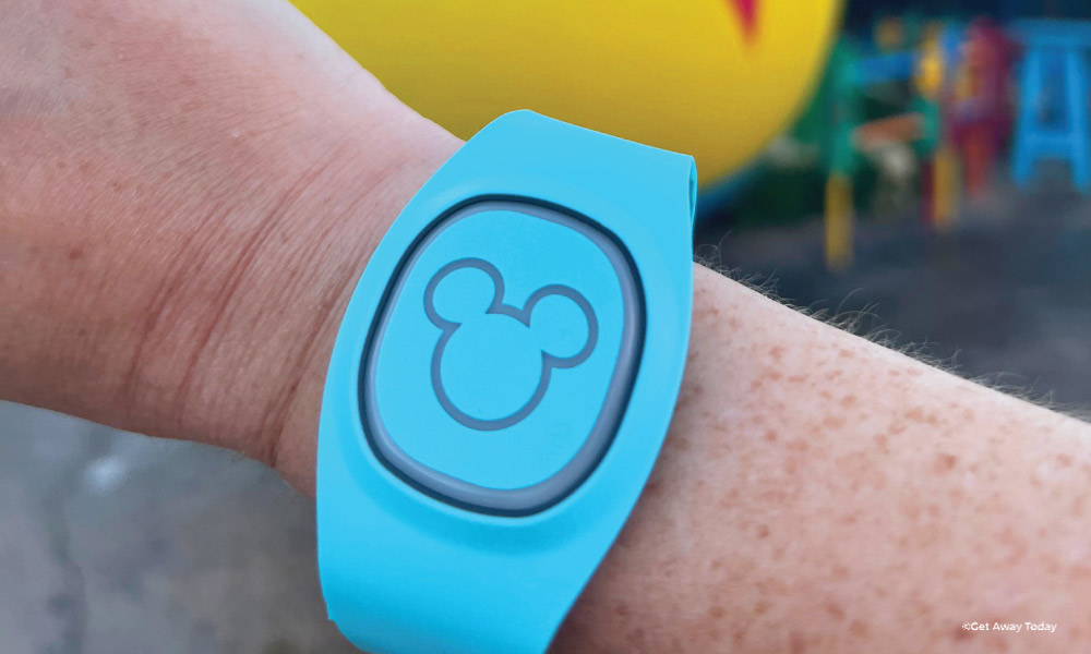 Light blue magic band with a mickey silhouette on a wrist