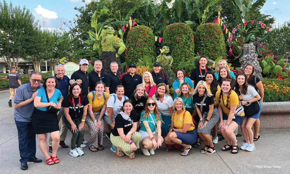 Get Away Today employees posing at EPCOT's Flower and Garden Festival