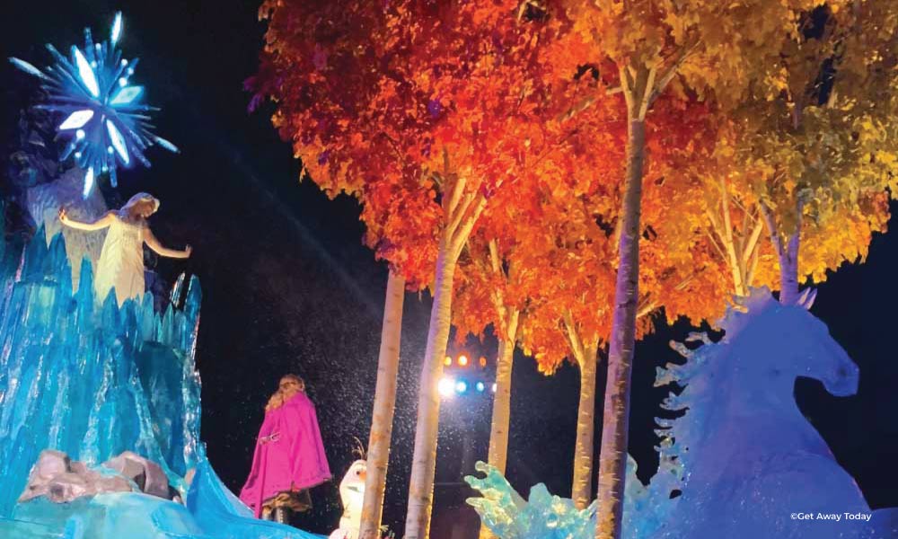 Frozen parade float with Anna and Elsa at night at Disneyland