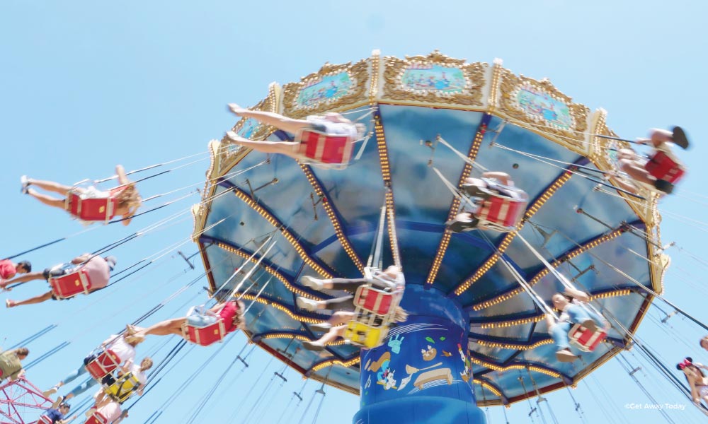 Silly Symphony Swings at Disneyland with people swinging