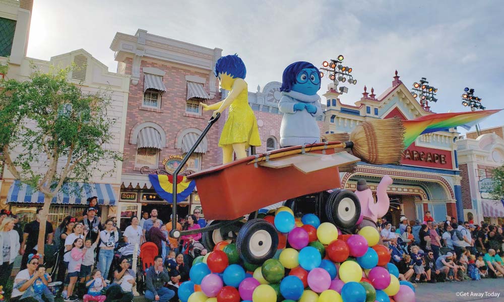 Sadness and Joy in a Wagon on Memory Balls during the Better Together Pixar Parade at Disneyland