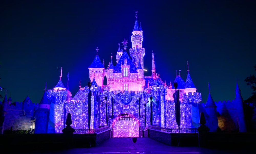 Sleeping Beauty Castle with 90s Nite Projections at nighttime