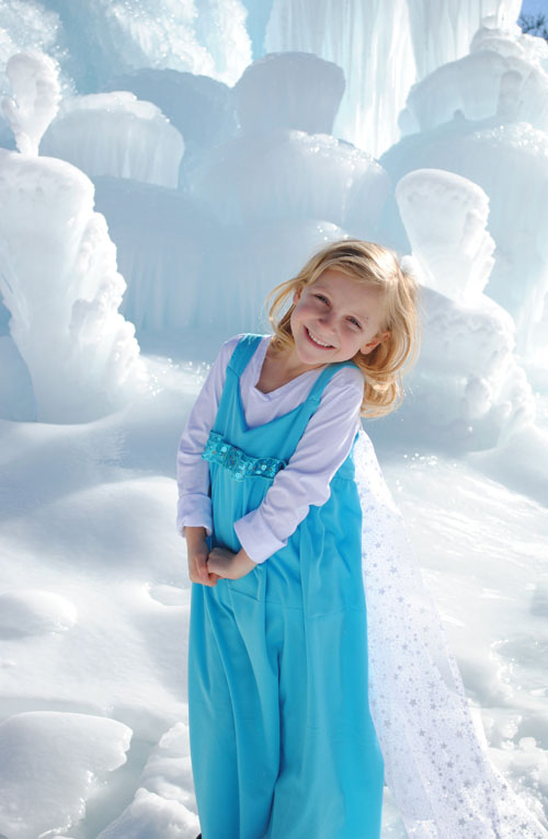 Little girl in a homemade Elsa Dress at the Ice Castles