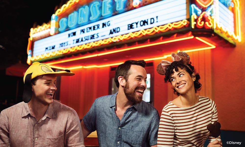 Friends laughing in front of Sunset Theater at Disney Hollywood Studios