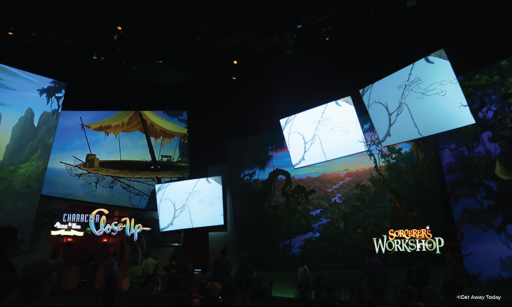 Large screens showing initial Disney sketches for Tarzan