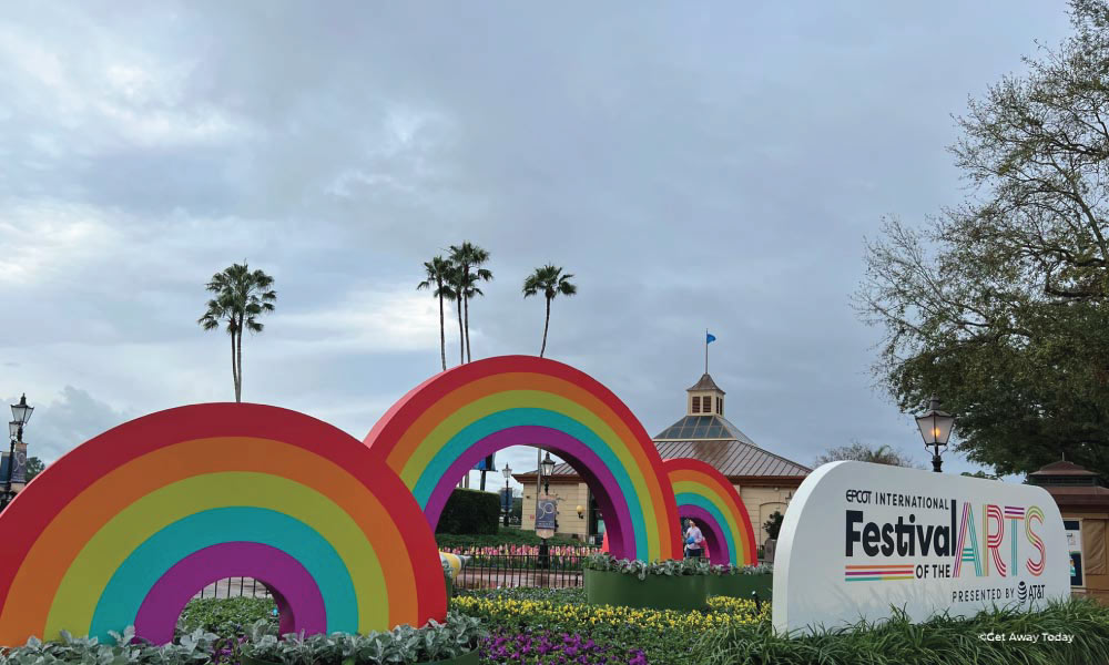 Large sinage with rainbow arches and logo of Festival of the Arts at Disney World