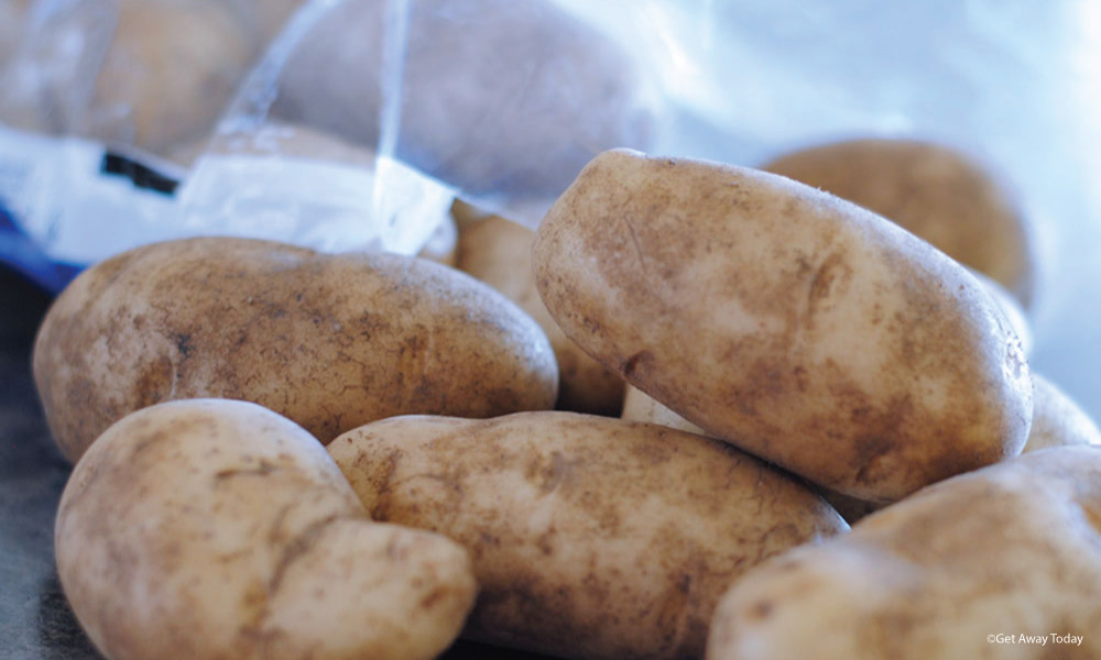 russet potatoes in a group on the counter