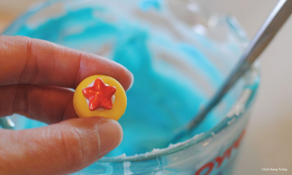 yellow candy melt and red star candy that looks like a pixar ball