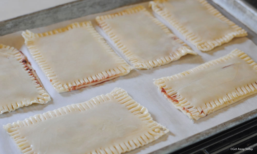 homemade poptarts uncooked on a baking sheet with parchment paper