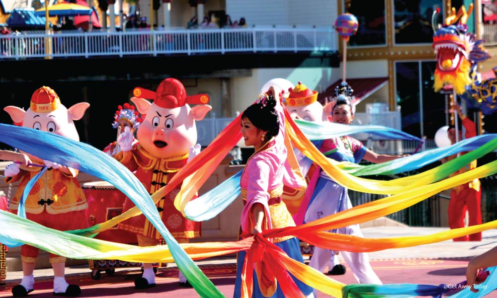 Mulan dancing with ribbons at Mulan's Processional during Lunar New Year