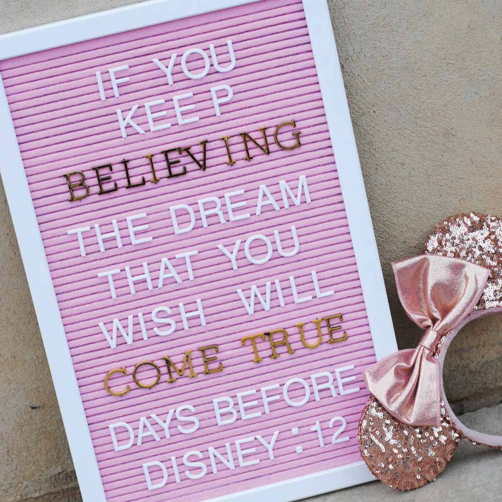 letterboard with gold letters and a disney quote with rose gold minnie ears