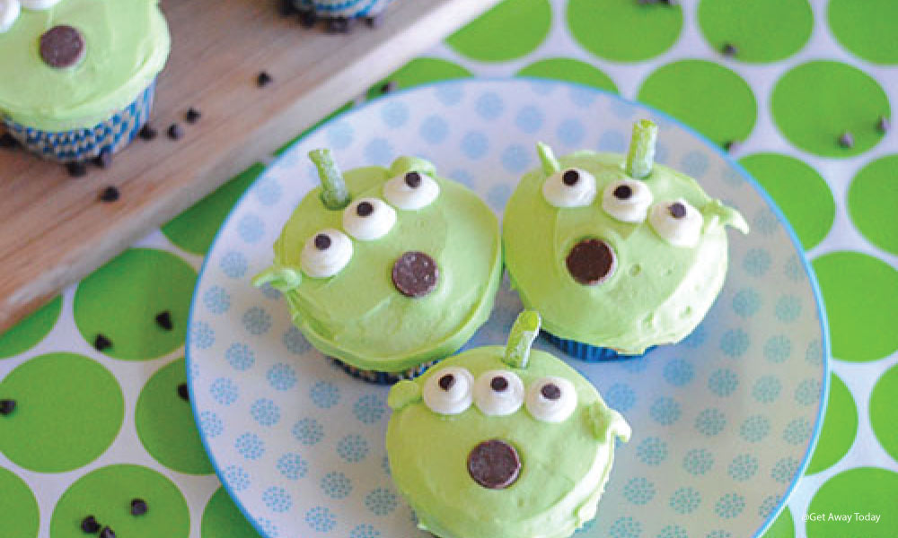 Three cupcakes decorated like the alients from Toy Story