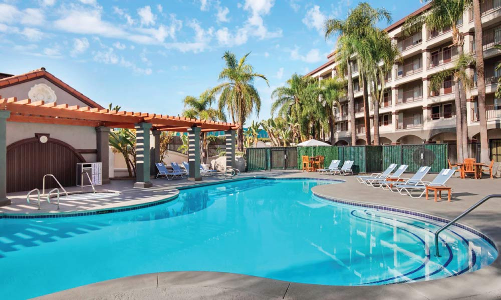 pool and pool chairs at a hotel